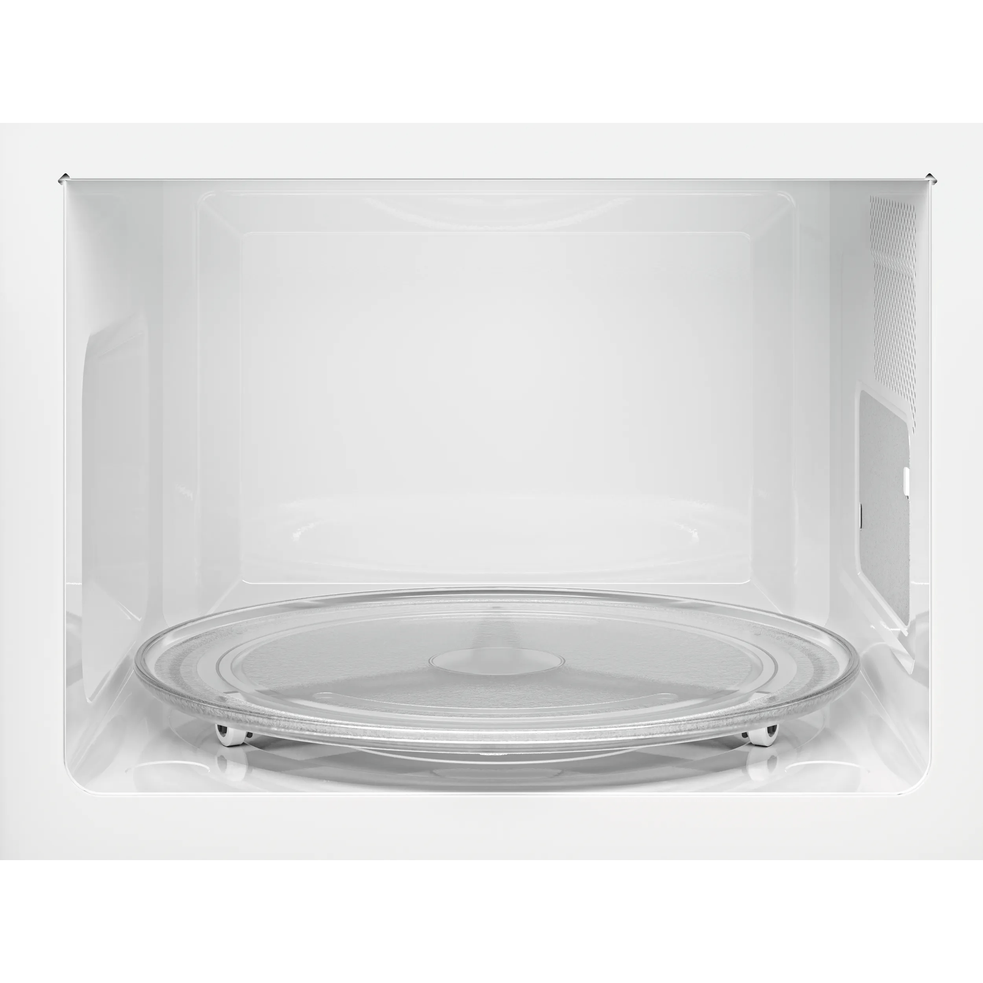 Interno di un microonde bianco con piatto girevole in vetro.