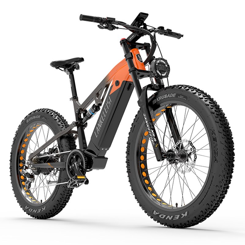 Una bicicleta eléctrica negra y naranja con llantas anchas y suspensión.