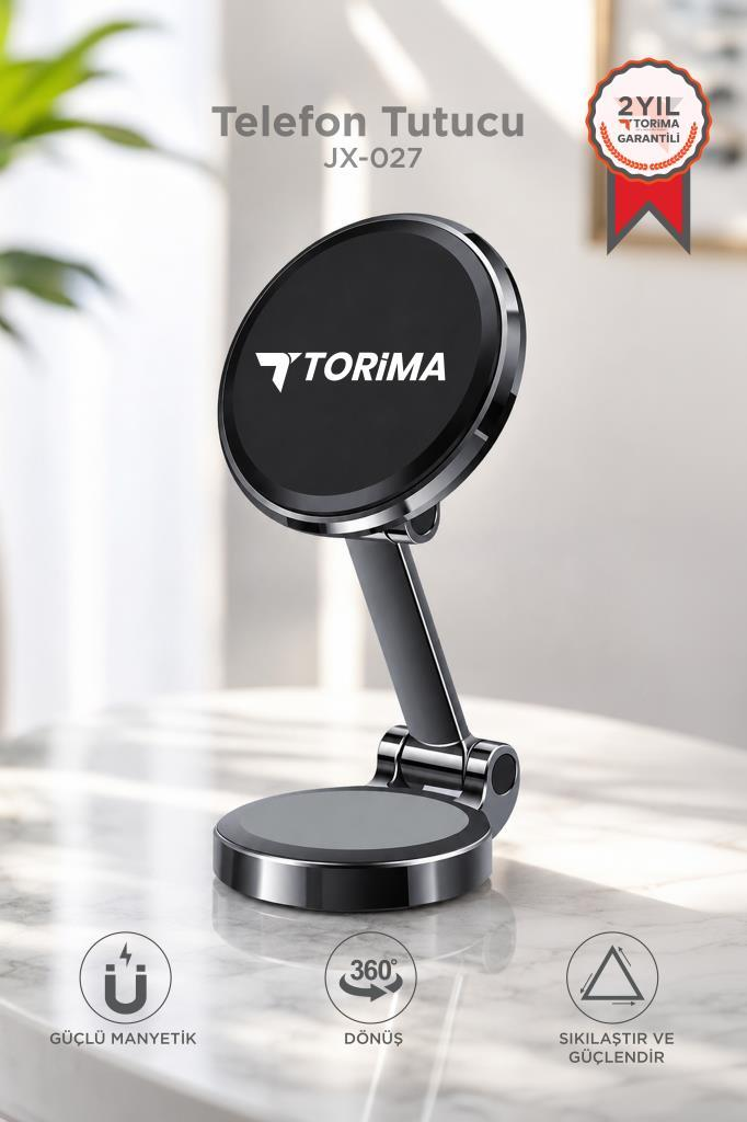 Torima logolu siyah telefon tutucu mermer bir masanın üzerinde duruyor.