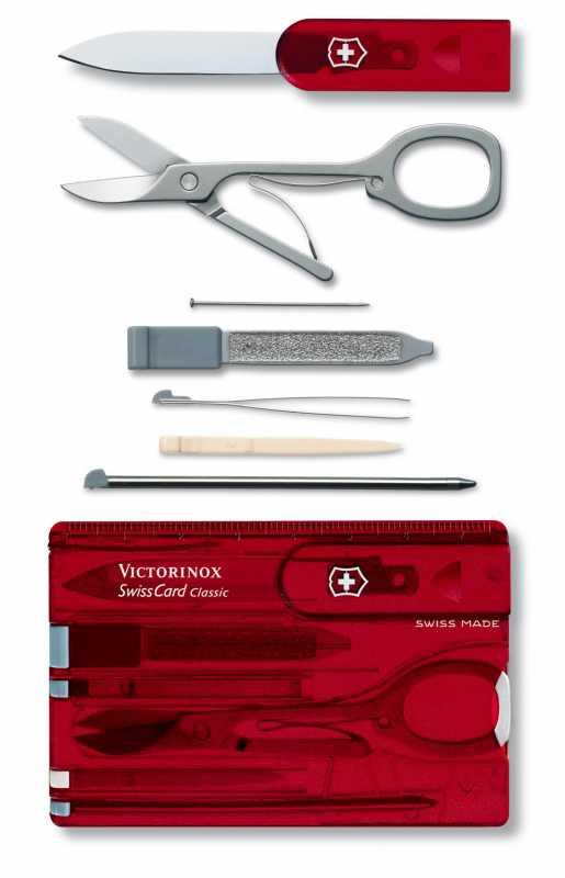 Bıçak, makas, tırnak törpüsü ve cımbız gibi aletleri olan kırmızı bir Victorinox SwissCard Classic.