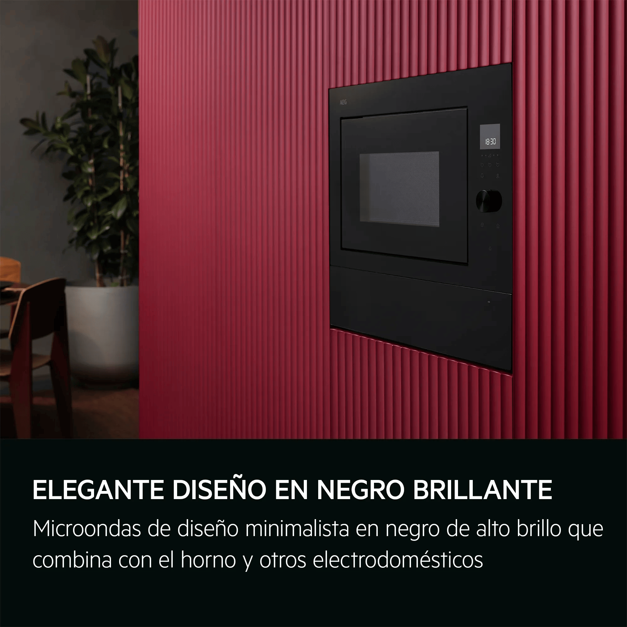 Un microonde da incasso nero con display digitale su una parete rossa.