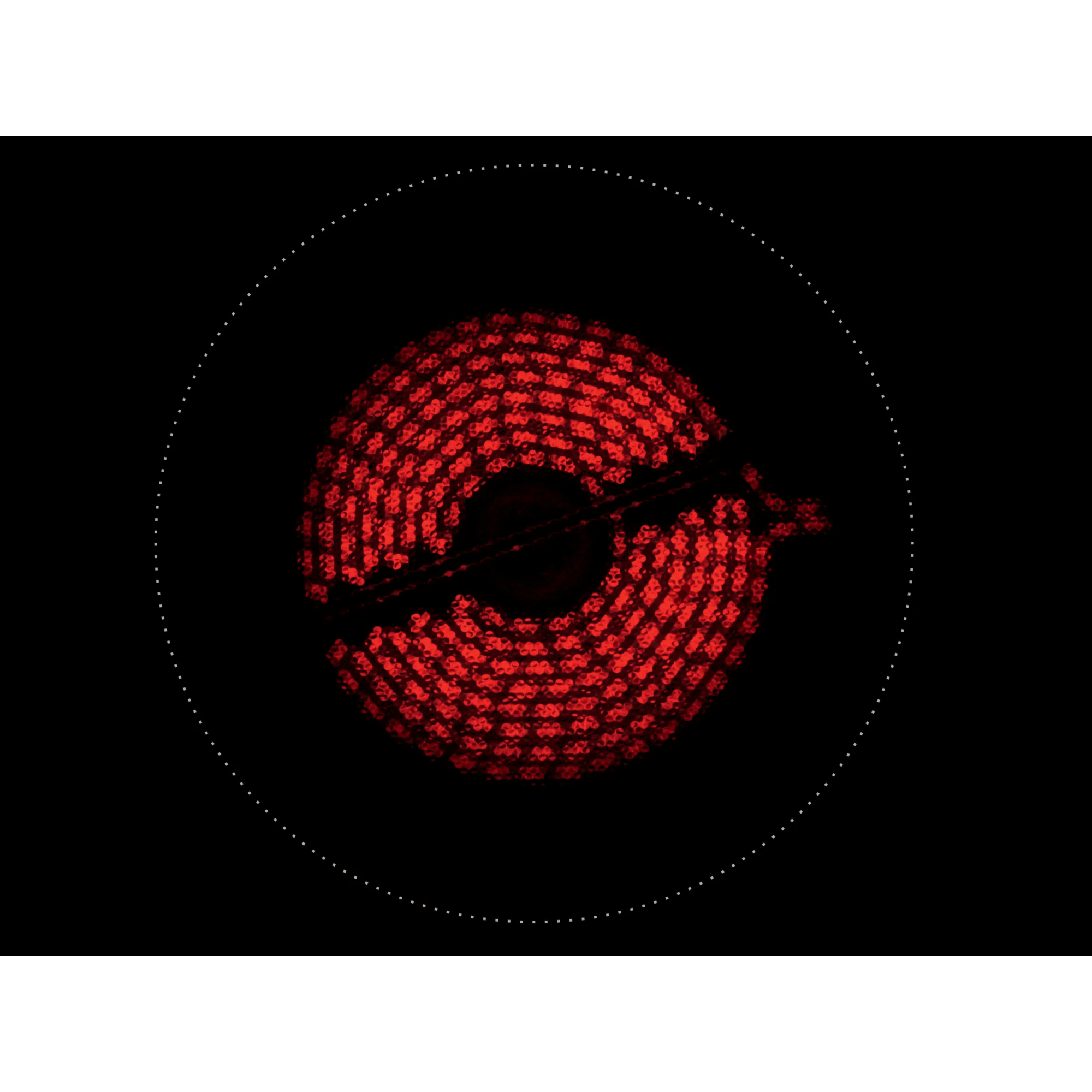 Un elemento calefactor rojo sobre una vitrocerámica negra con círculo de puntos.