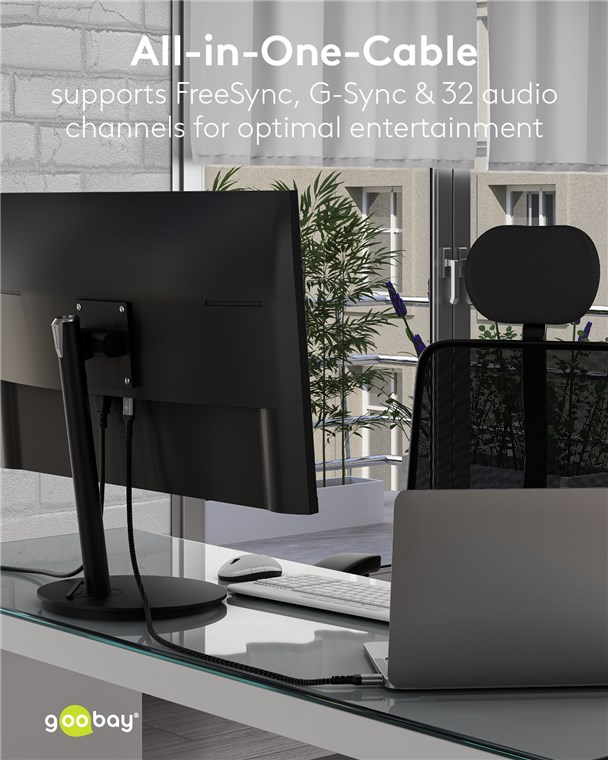 Ein Schreibtisch mit Monitor, Laptop, Tastatur und Maus.