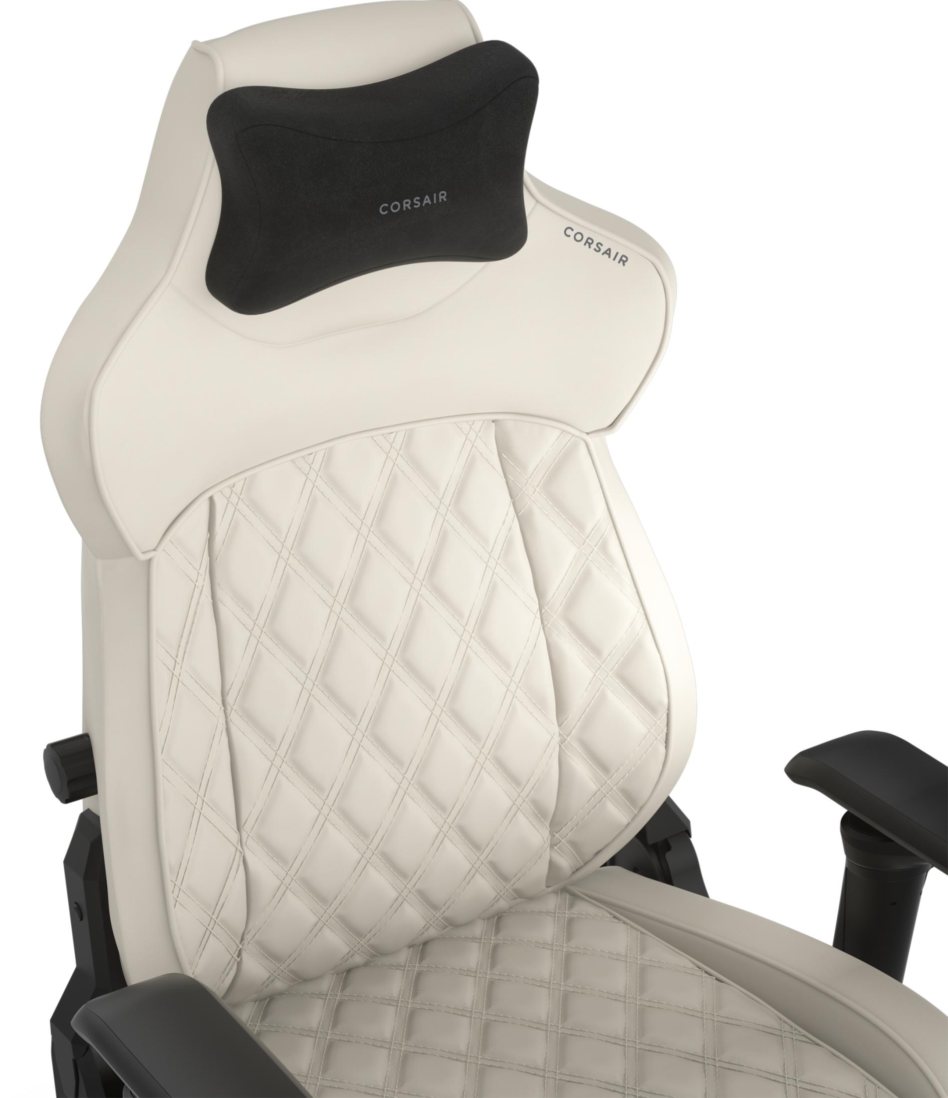 Ein cremefarbener Gaming-Stuhl mit schwarzem Nackenkissen und Raute