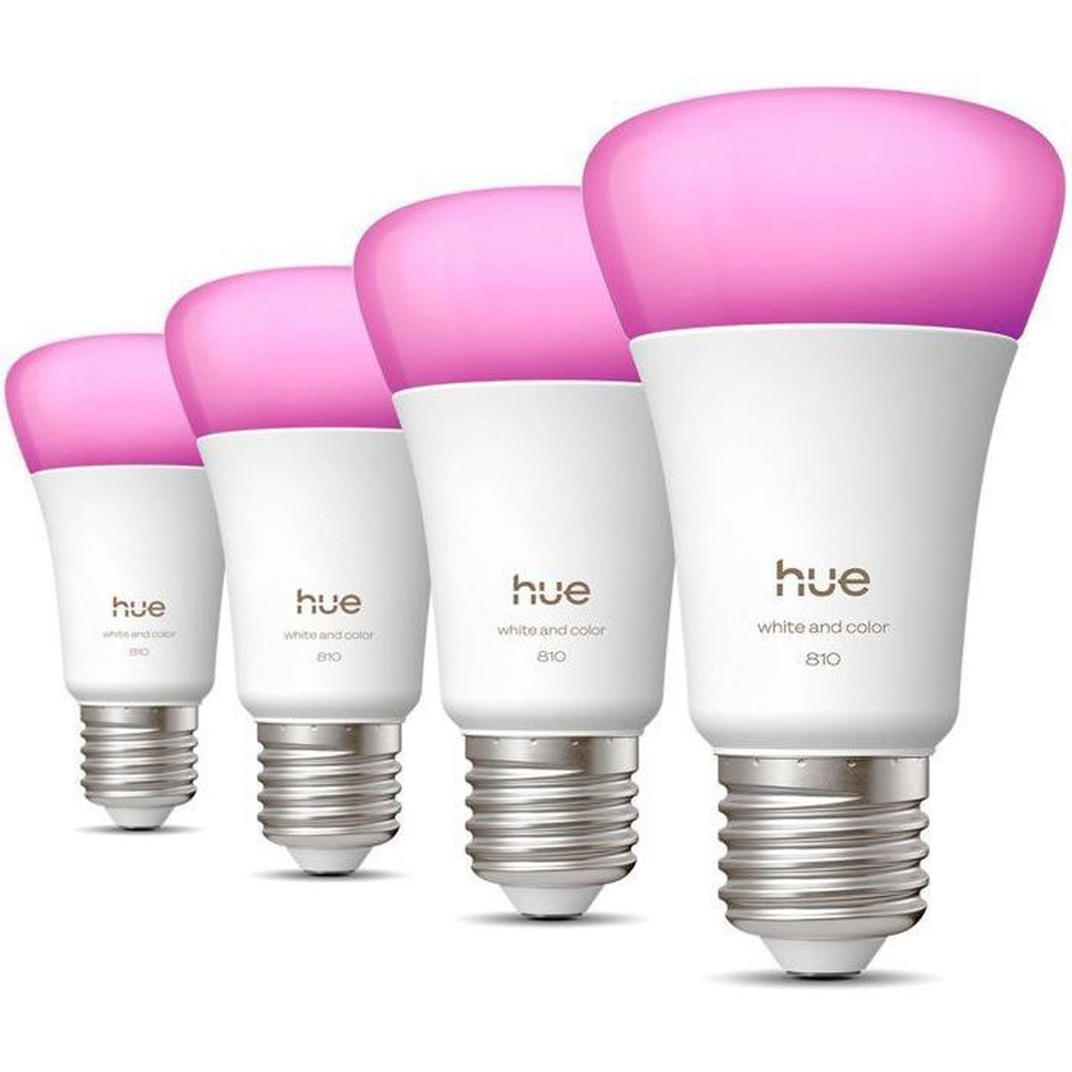 Cuatro bombillas Hue blancas con luz rosa brillan una al lado de la otra.