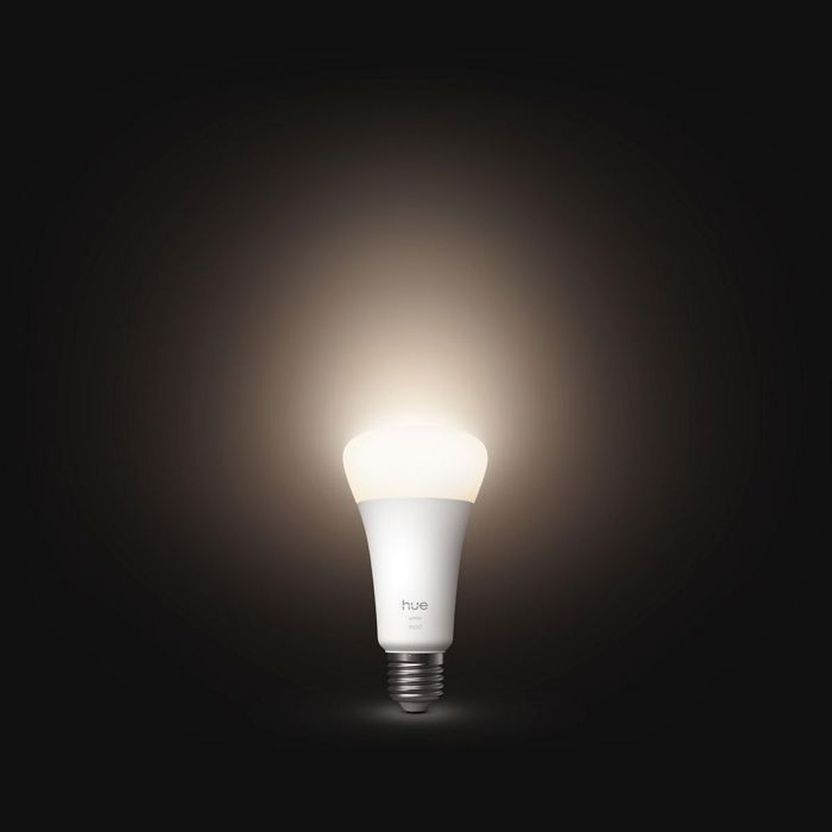Una lampadina bianca con il logo Hue brilla su sfondo nero.