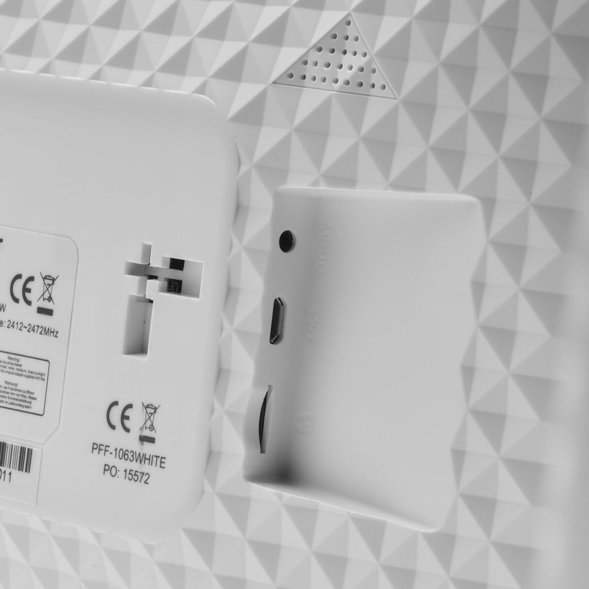 White electronics with ports and CE marking.