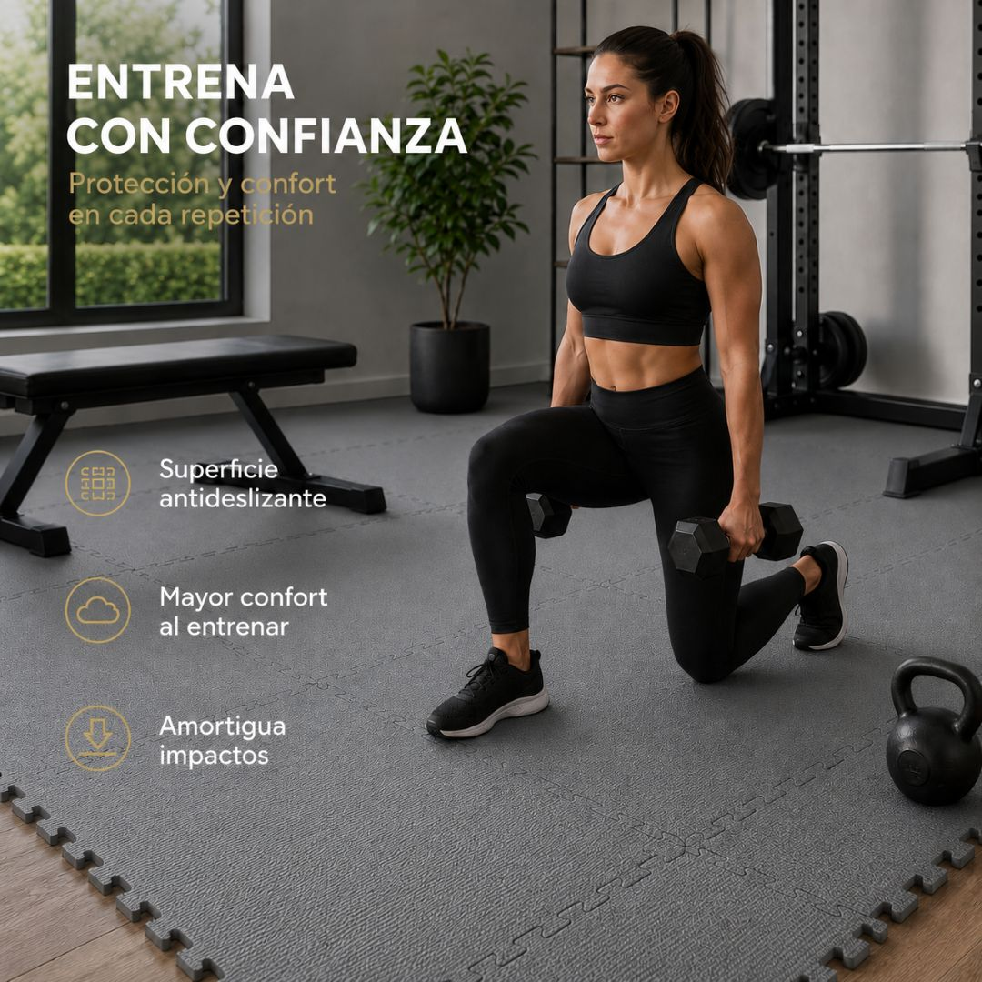 Mujer haciendo zancadas con mancuernas en un gimnasio sobre colchonetas grises.