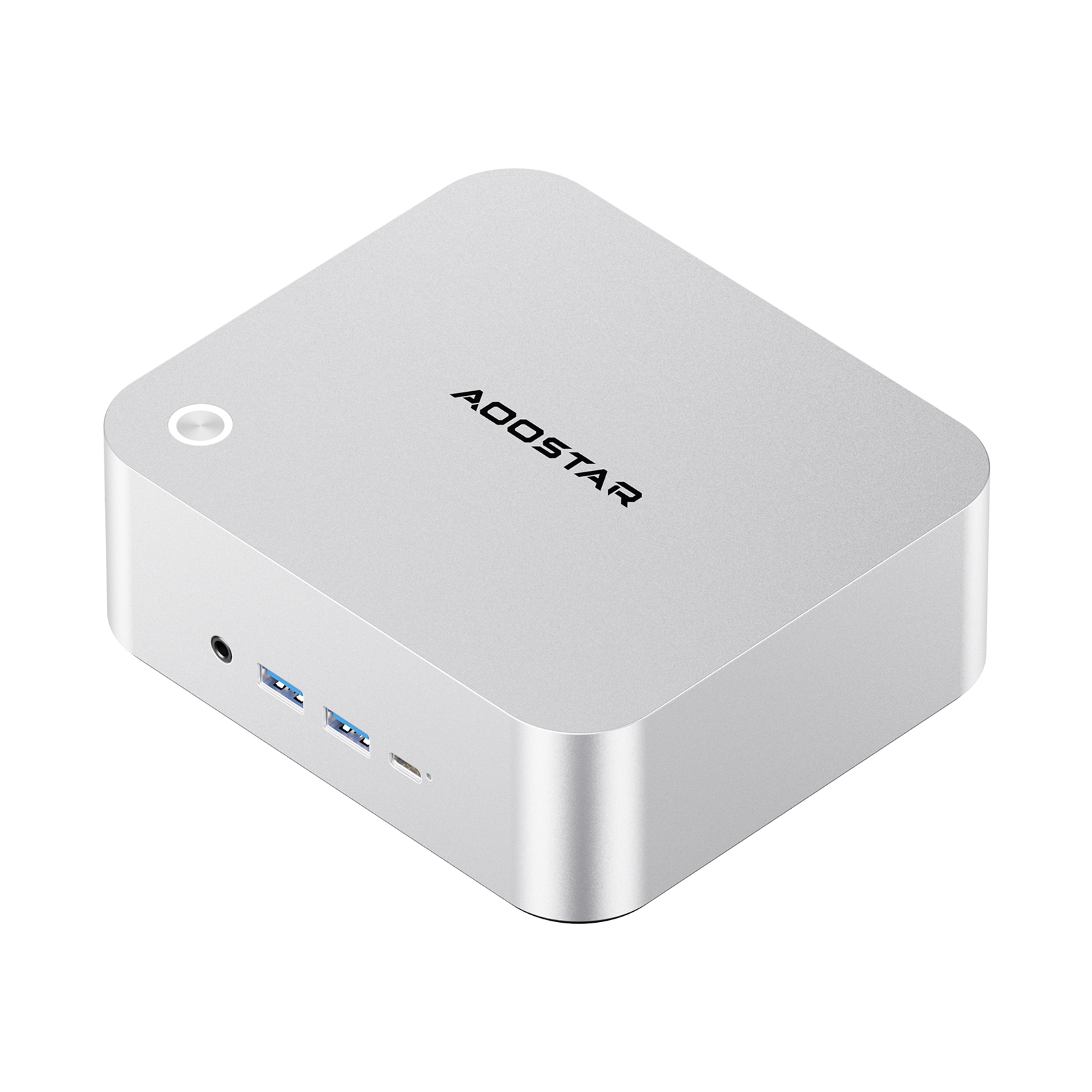 Mini PC plateado con logo AOCSTAR, puertos USB y botón de encendido.