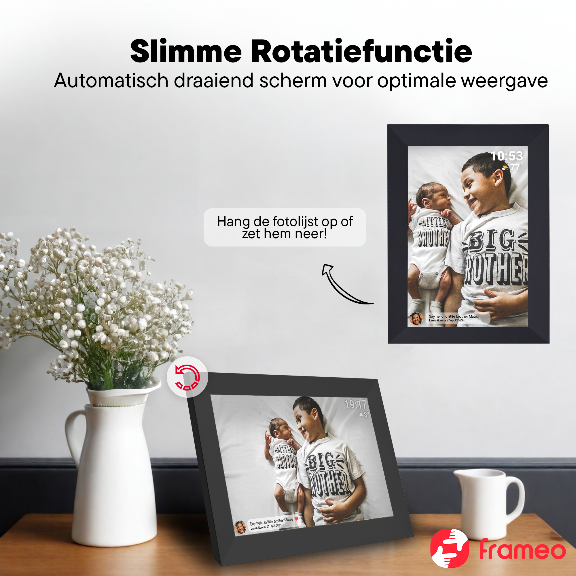 Digital frame shows two brothers, one holding a baby. Flowers & pitcher in foreground.