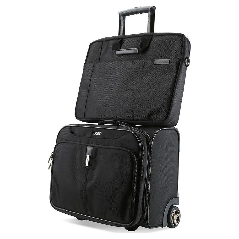 Zwei schwarze Rollkoffer/Taschen sind übereinander gestapelt. Oben ist eine Laptoptasche.