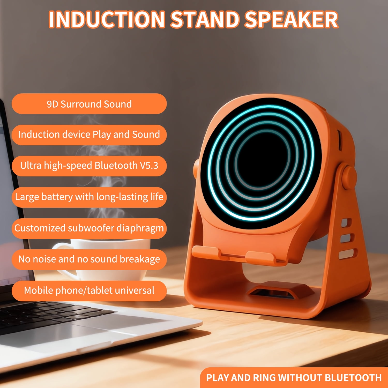 Orange Induktions-Lautsprecher mit Handyhalterung, Laptop und Tasse im Hintergrund.