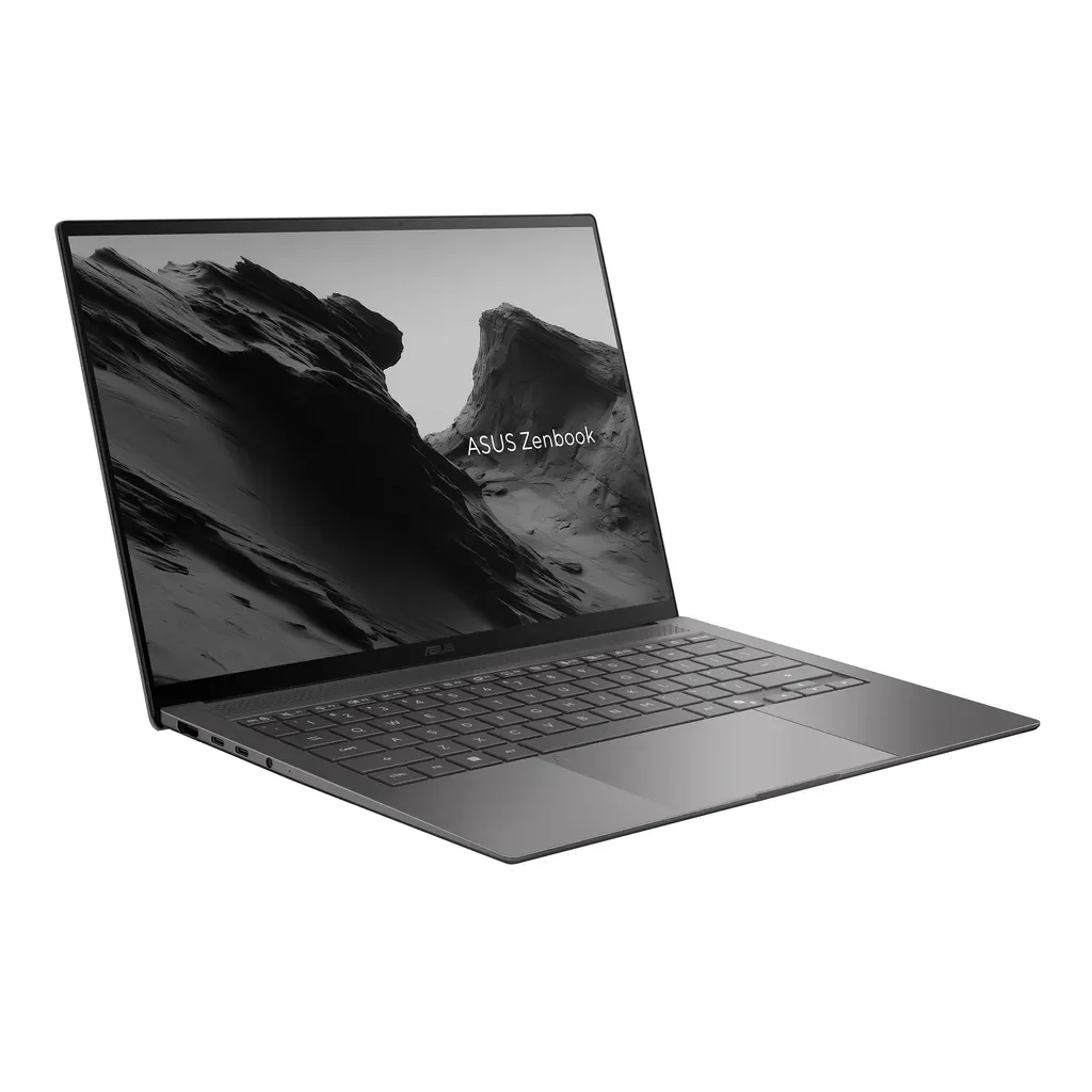Şık, koyu gri bir ASUS Zenbook dizüstü bilgisayar açık durumda, ekranında gri tonlamalı bir dağ manzarası gösteriyor.