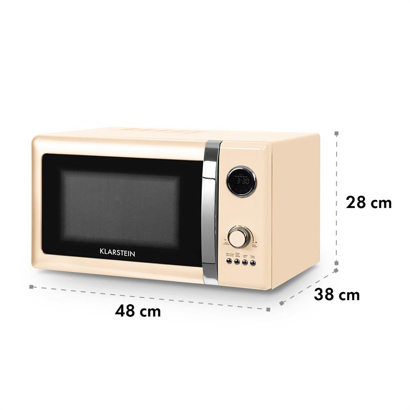 Un forno a microonde retrò color crema con accenti argentati e display digitali.