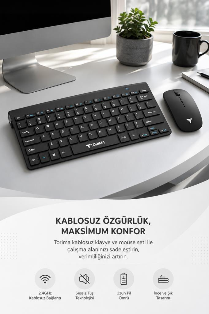 Siyah kablosuz klavye ve fare masada, monitör, saksı bitkisi ve kupa ile.