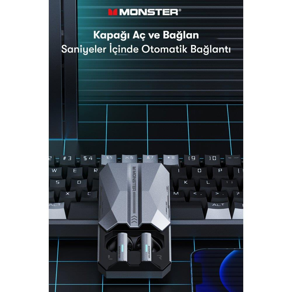 Monster logolu klavye üzerinde şarj kutusunda gri kulaklıklar.