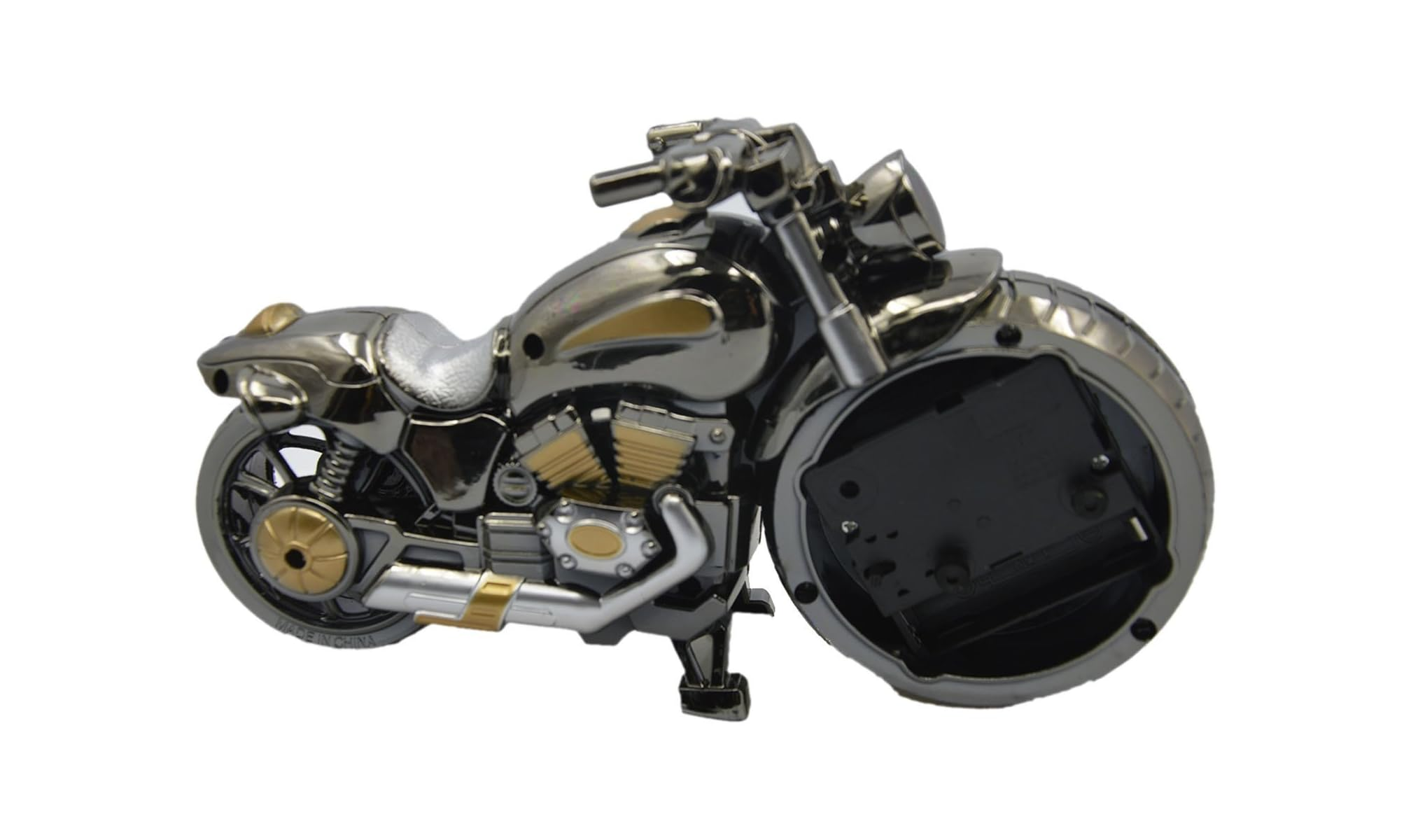 Eine verchromte und goldene Motorraduhr mit freiliegenden Zahnrädern rechts.