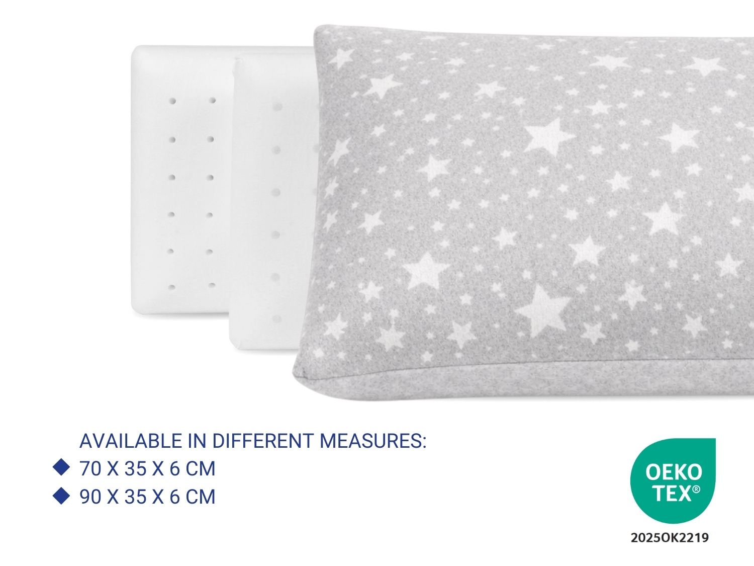 Almohada gris con estrellas blancas y dos almohadas de espuma blancas al lado.