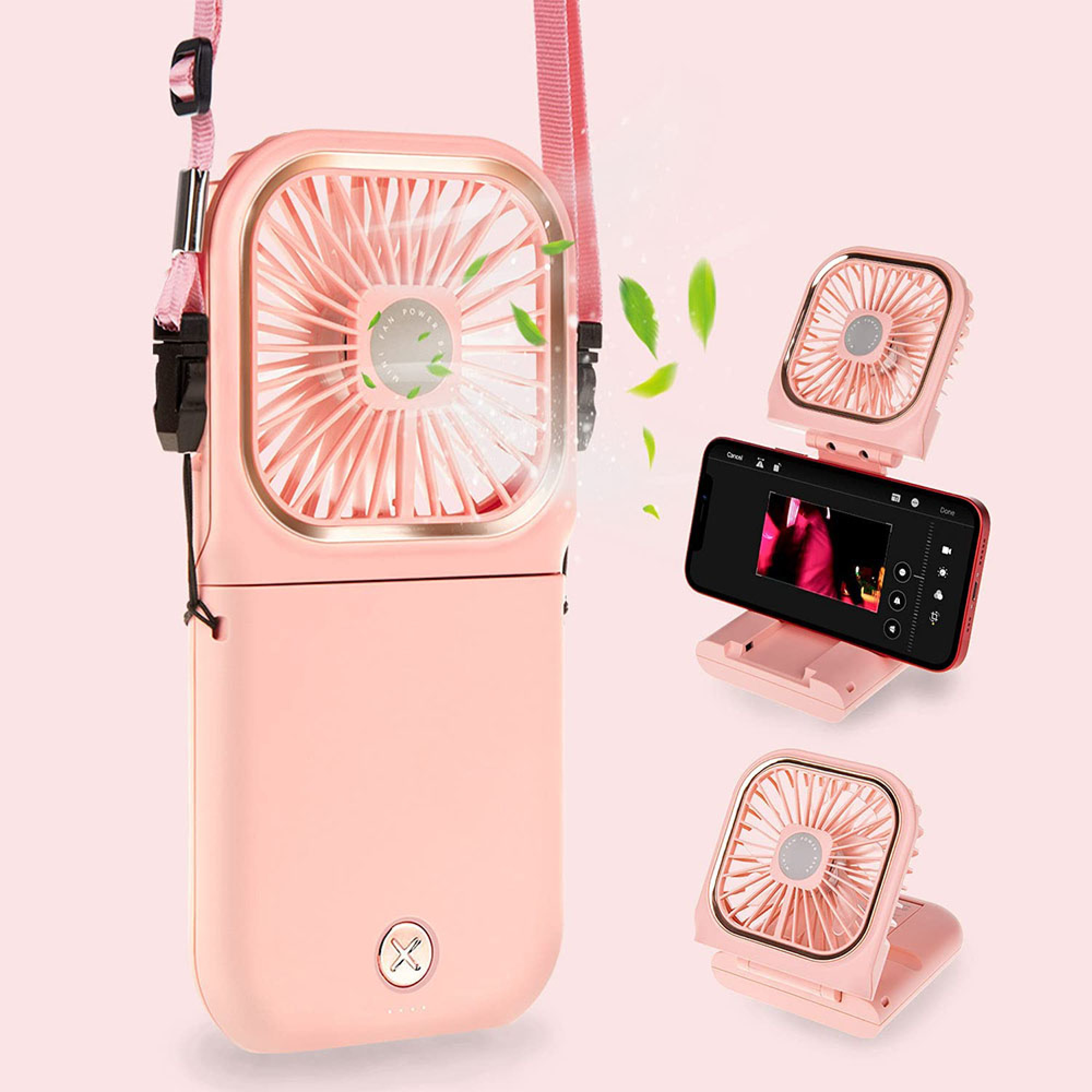 Ein rosafarbener tragbarer Ventilator mit einem Handy, das auf einem Ständer steht.
