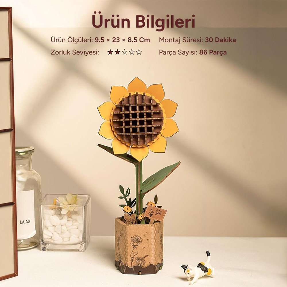Kit de fleurs en bois : Tournesol en pot avec un chat et un vase en verre à proximité.