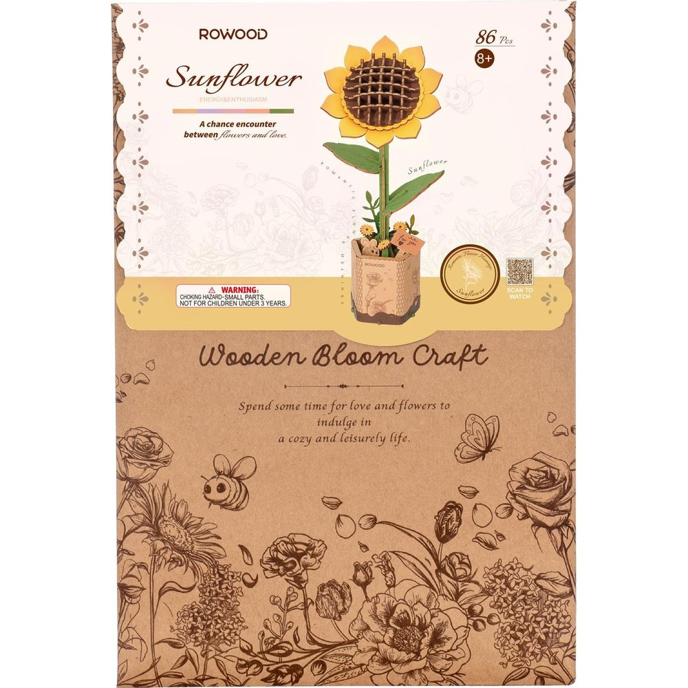 Verpackung für ein hölzernes Sonnenblumen-Bastelset mit Warnhinweis.