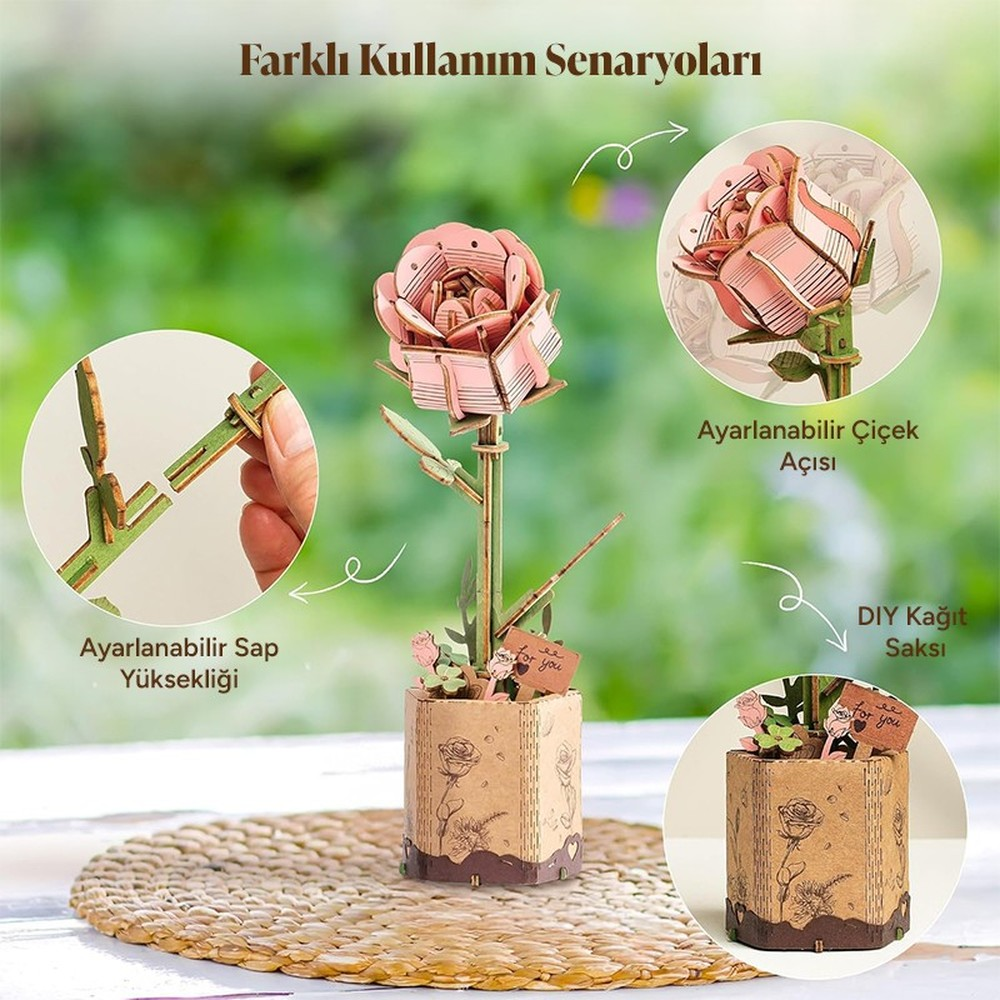 Ein rosa Holzrosen-Bausatz in einem braunen Topf mit detaillierten Schnitzereien.
