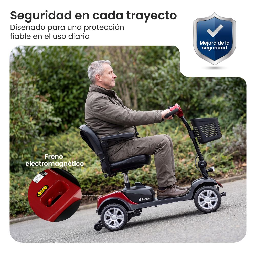 Hombre conduciendo un scooter de movilidad rojo y negro al aire libre. Primer plano de la palanca de freno.
