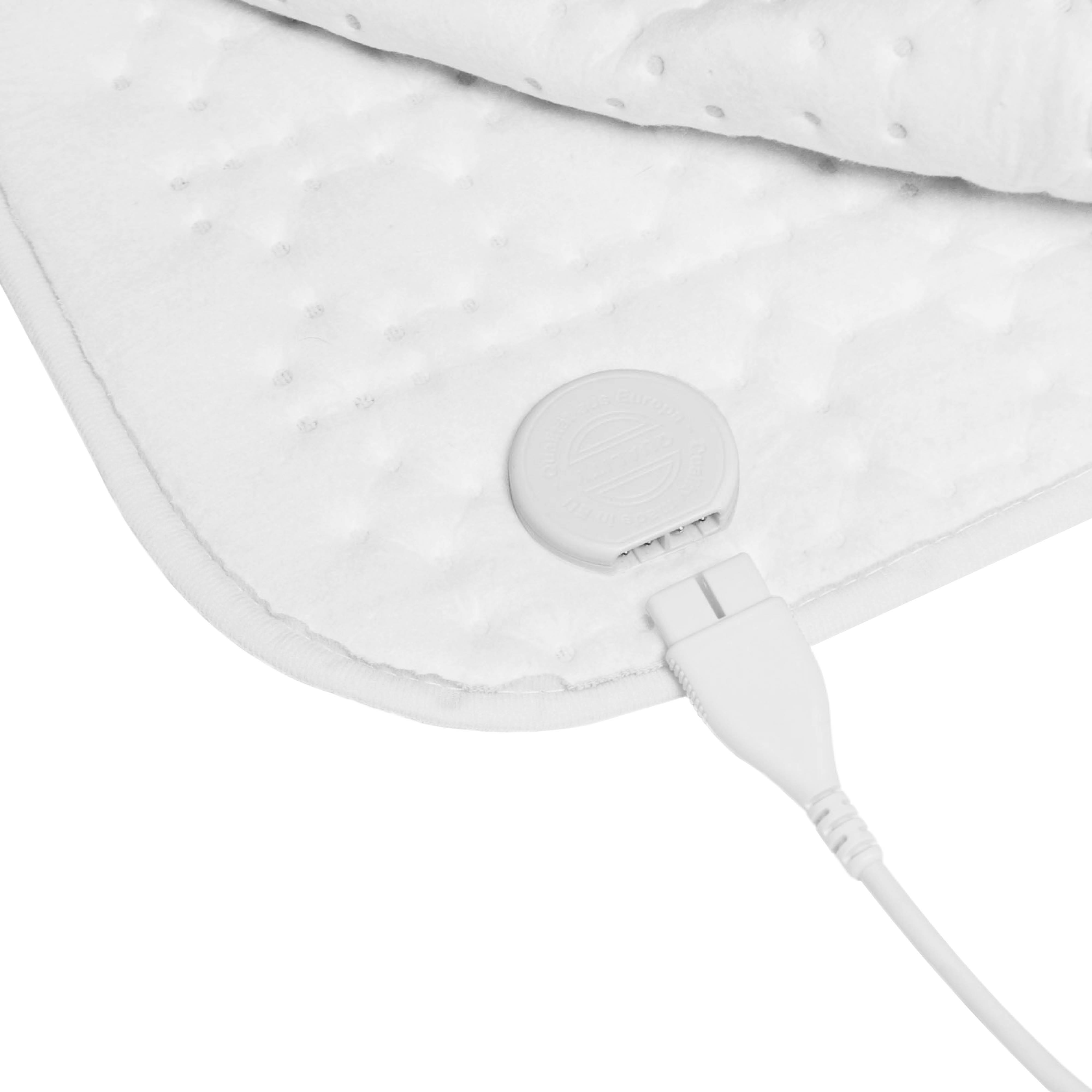 Close-up of a white heated blanket with a white cord and plug attached.