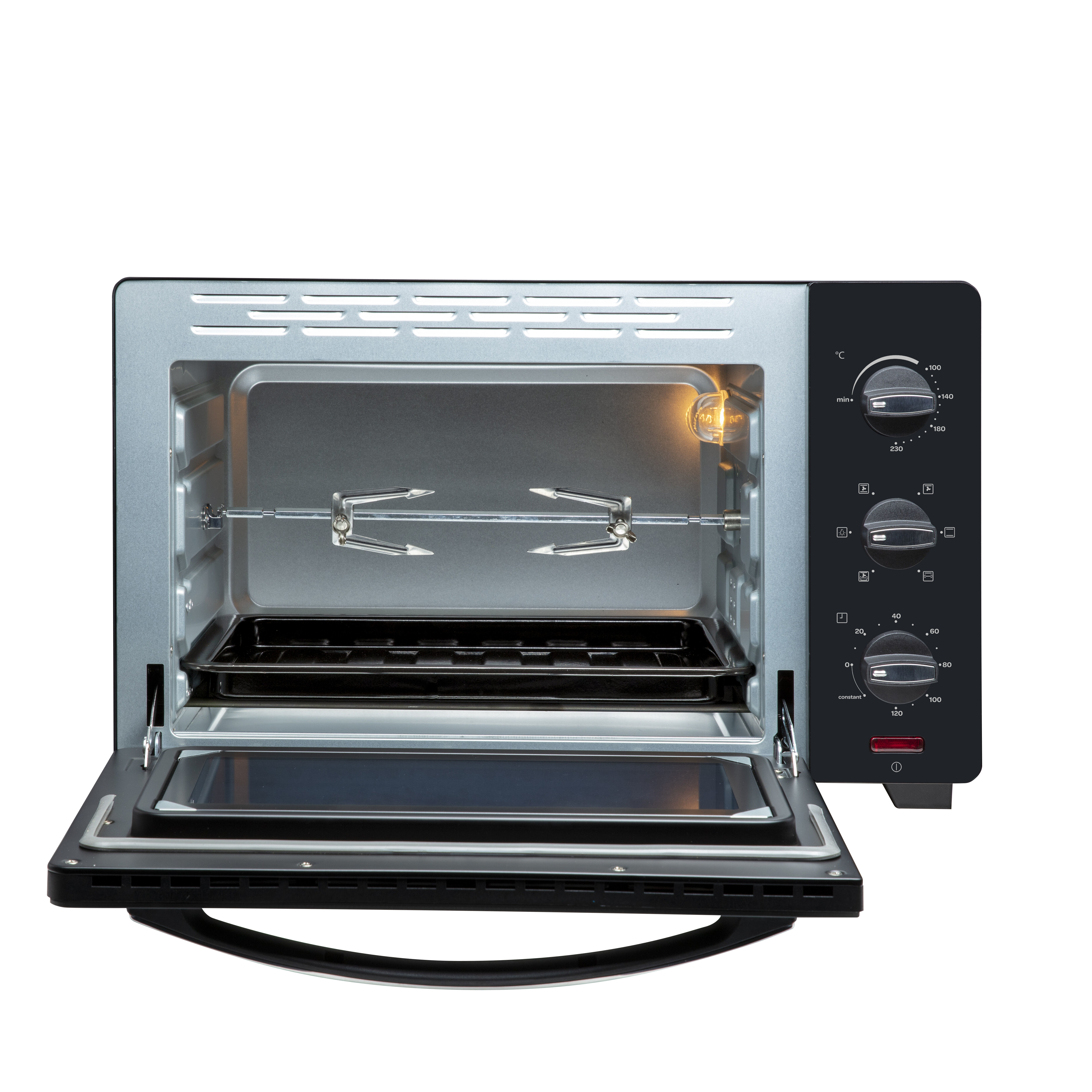 An open mini oven with rotisserie, baking tray, and control knobs.