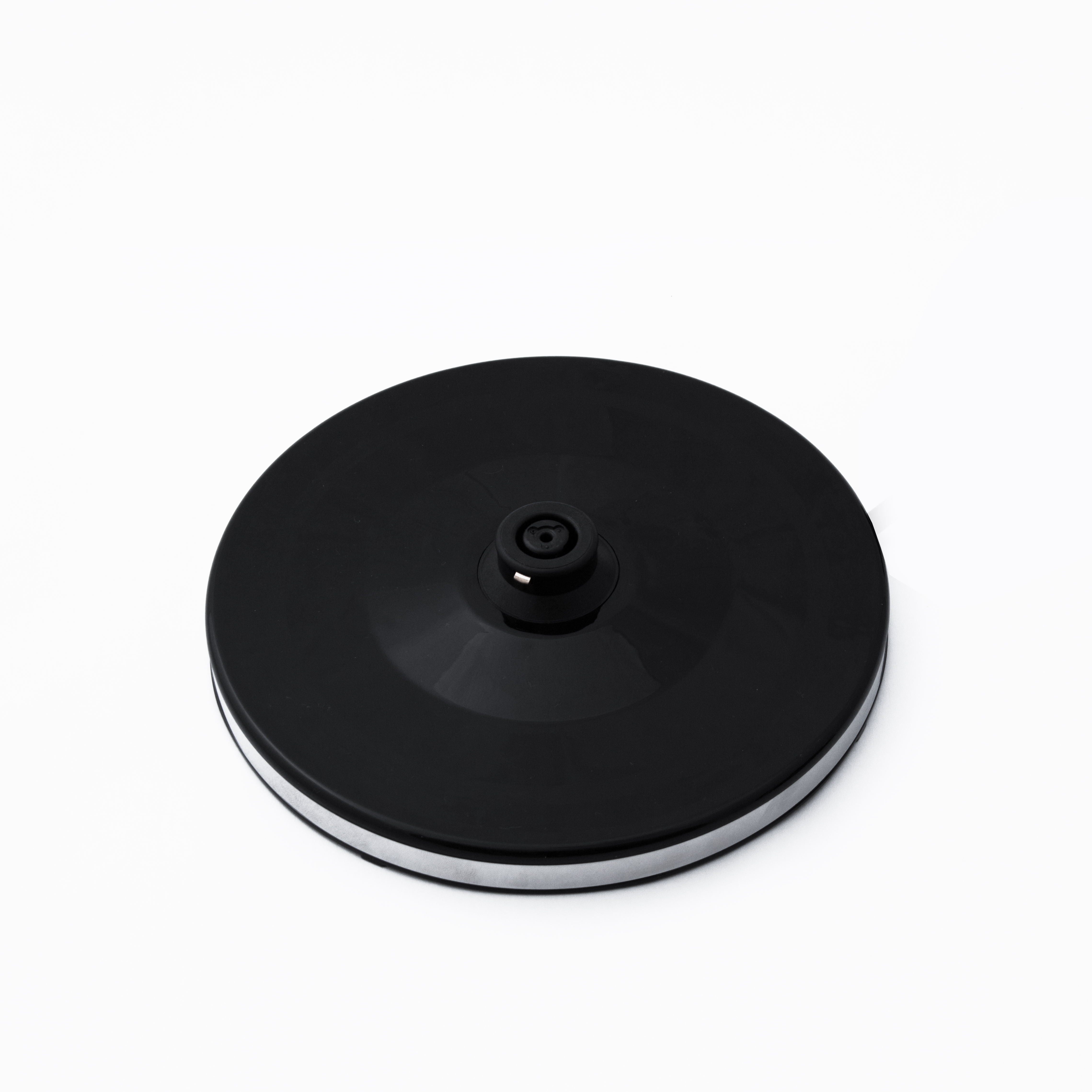 A black round base with a silver rim on a white background.