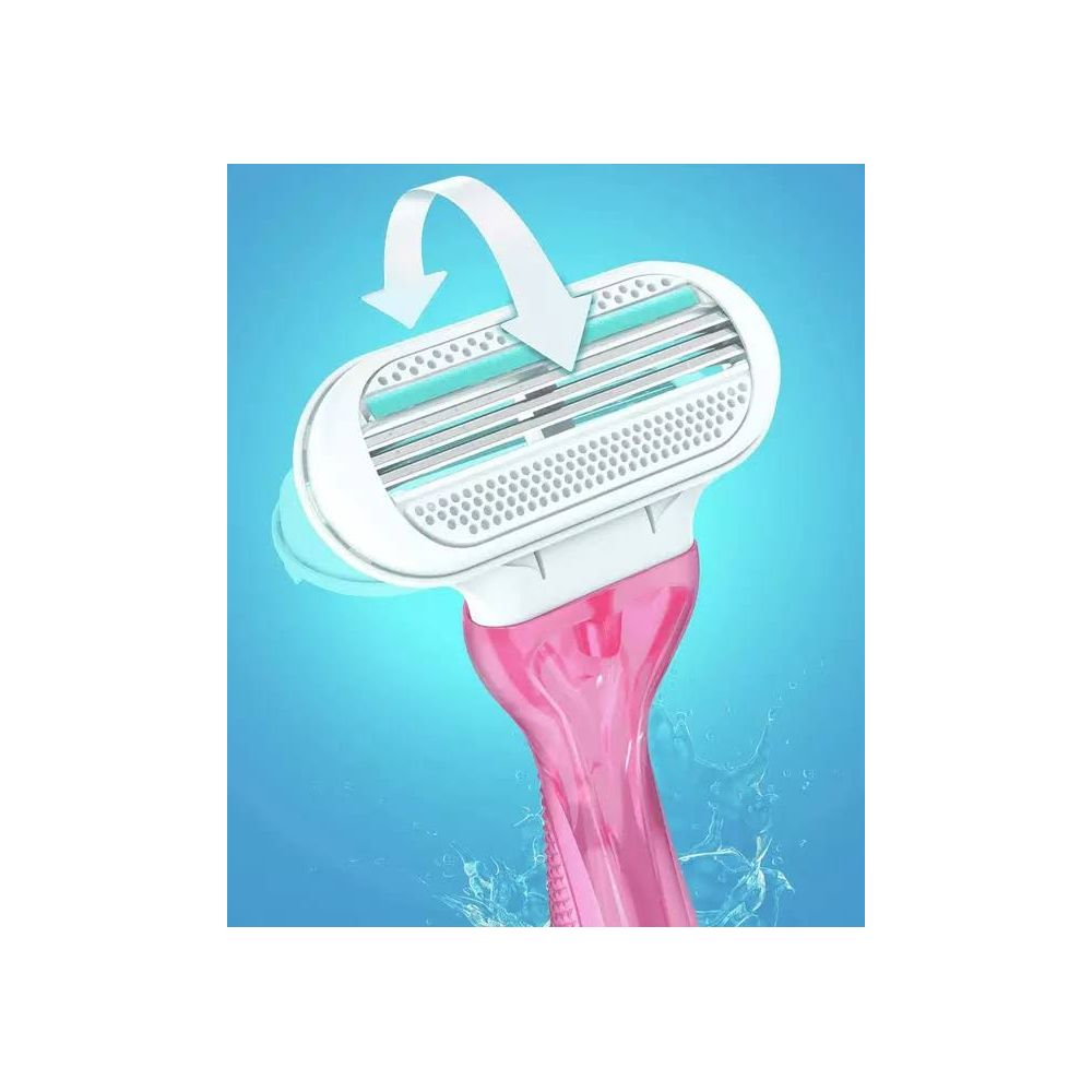 Un rasoio rosa con lame bianche e turchesi su sfondo blu.