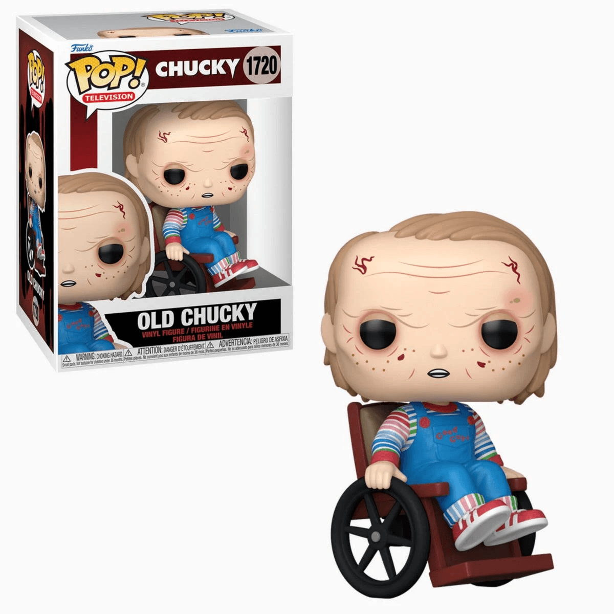 Muñeco Chucky en silla de ruedas con embalaje. Lleva peto azul y camisa a rayas.