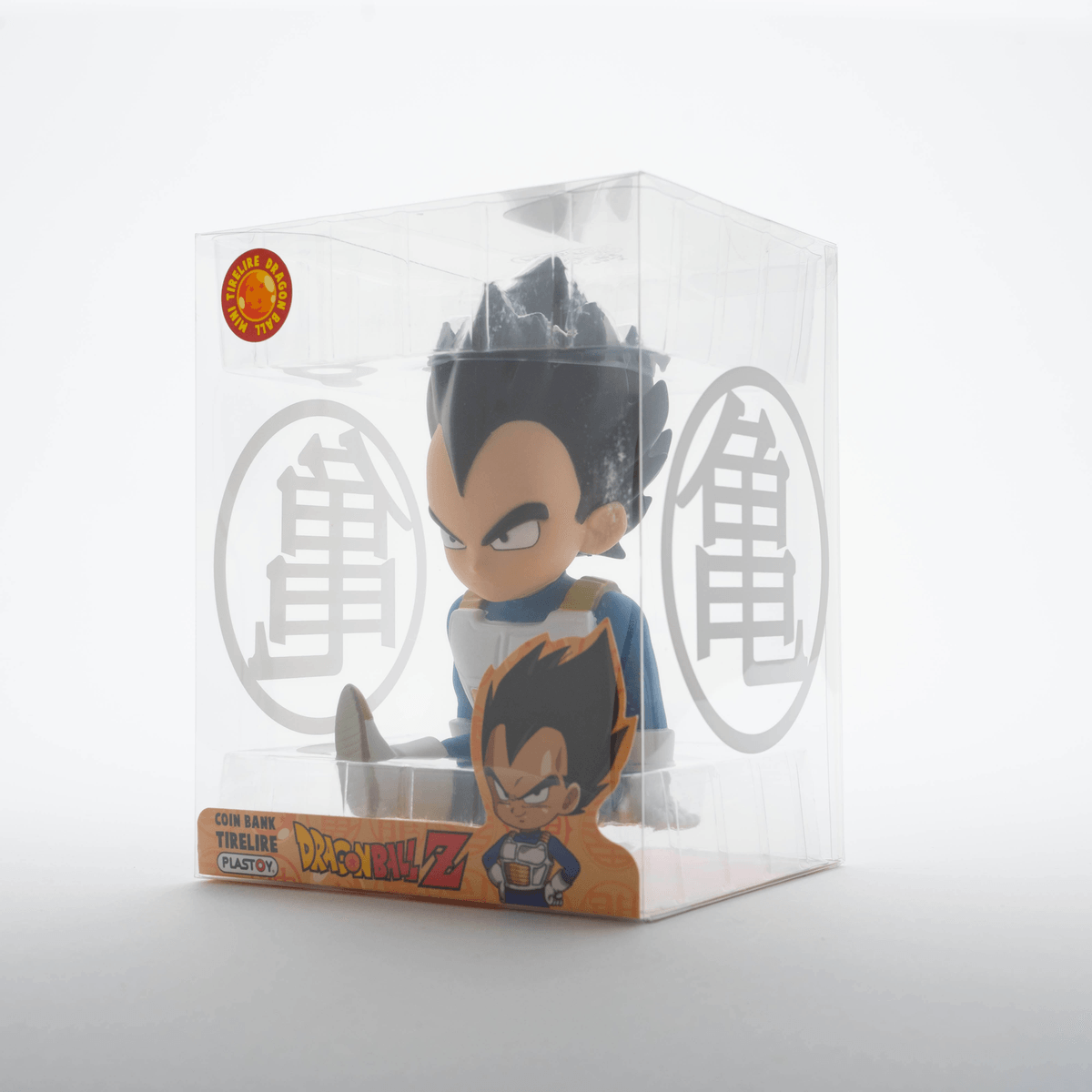 Una figura de alcancía de Vegeta de Dragon Ball Z en caja plástica.