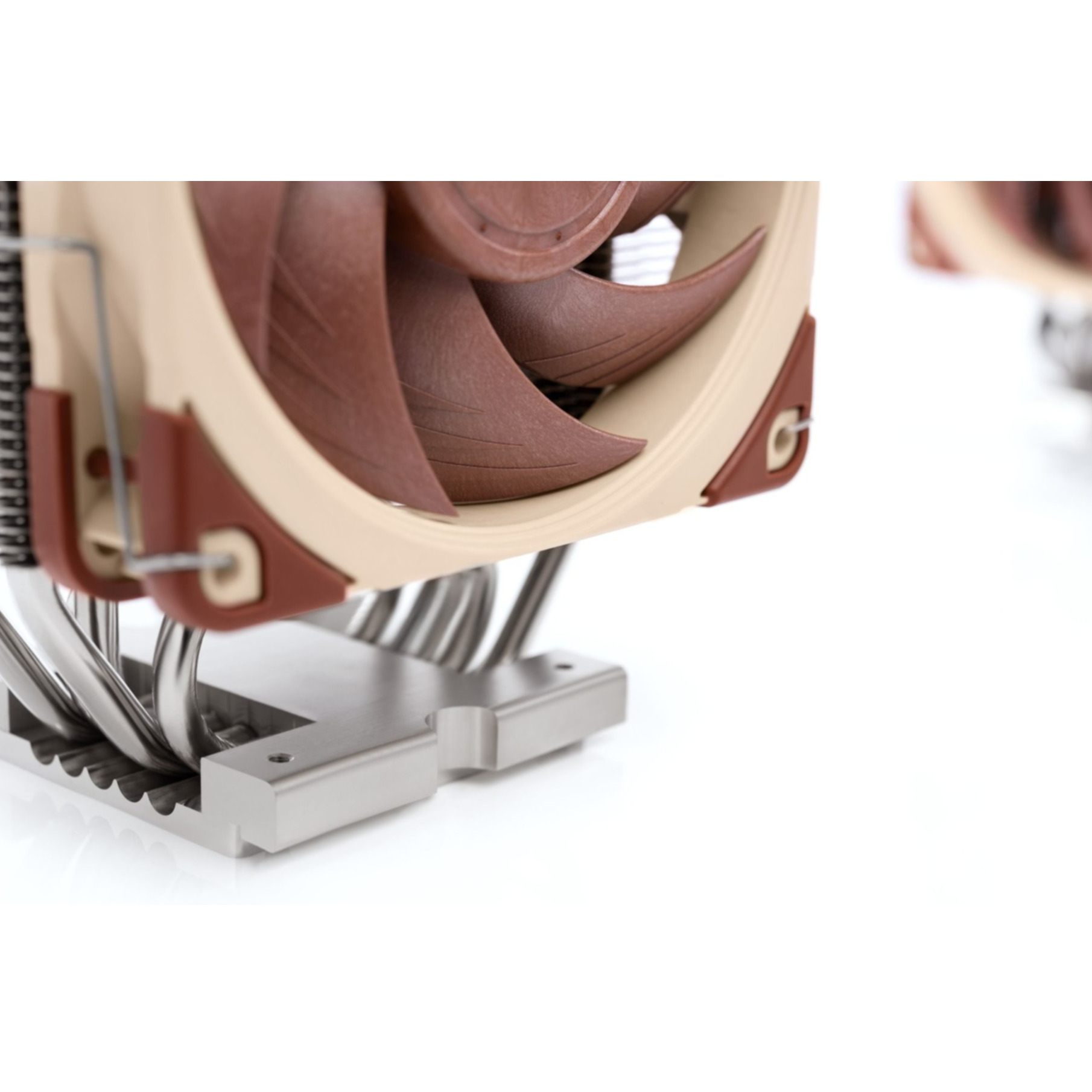 A CPU cooler with brown fan blades and silver heat pipes.