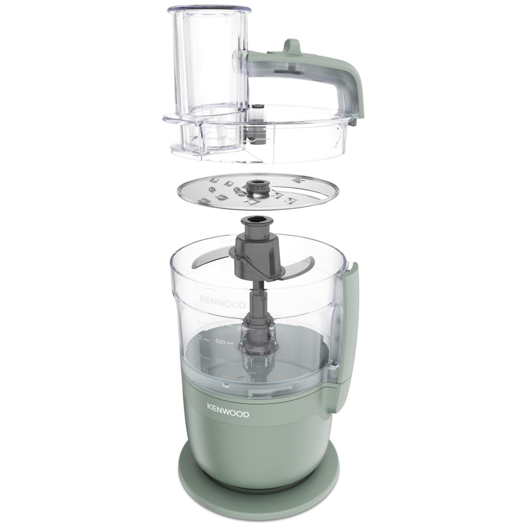 Un robot da cucina Kenwood smontato in verde chiaro e trasparente, con lame e ciotole.