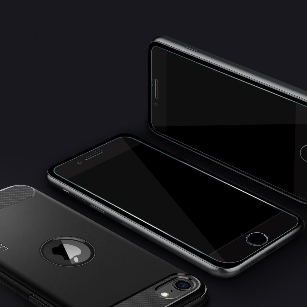 Three dark smartphones with screen protectors on a black background.
