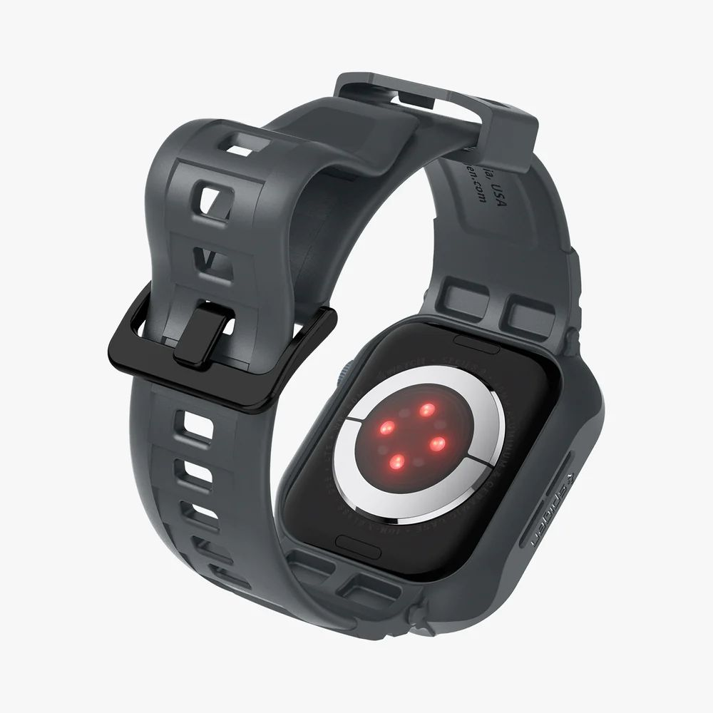 Smartwatch grigio con sensore di frequenza cardiaca visibile e fibbia nera.