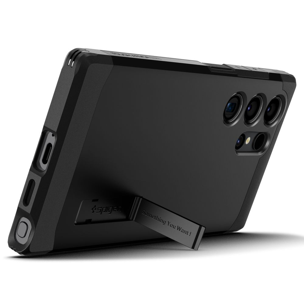 Custodia nera per telefono con supporto integrato e ritagli per fotocamera.