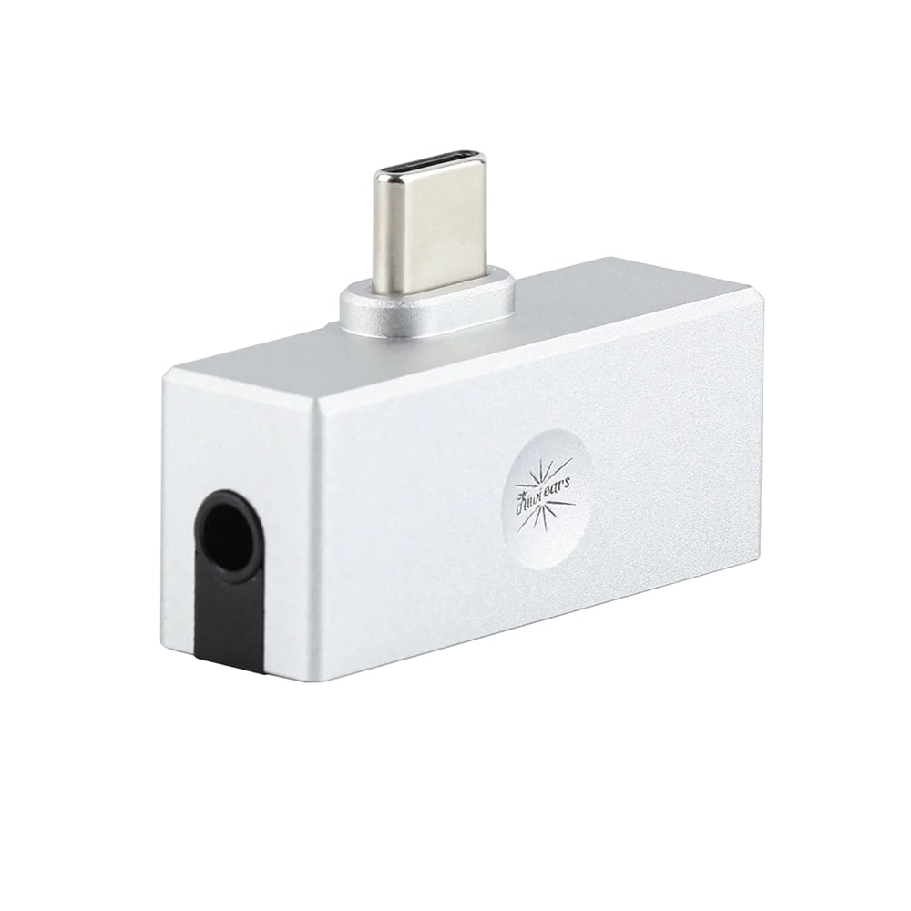 Gümüş renkli USB-C - 3,5 mm ses adaptörü, kulaklık jakı ve USB-C konektörü bulunur.