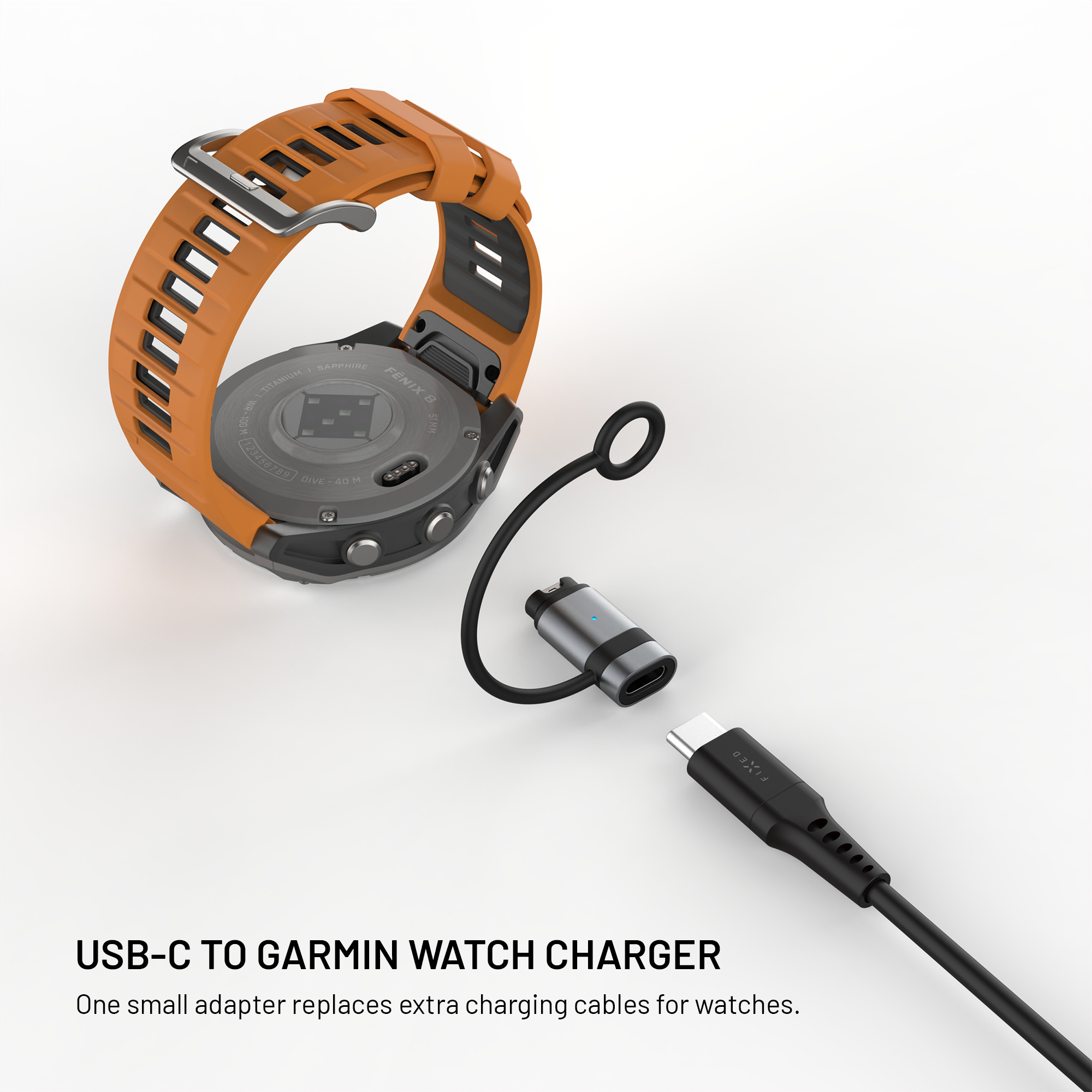 Orange Garmin Uhr mit USB-C Ladekabeladapter auf weißem Hintergrund.