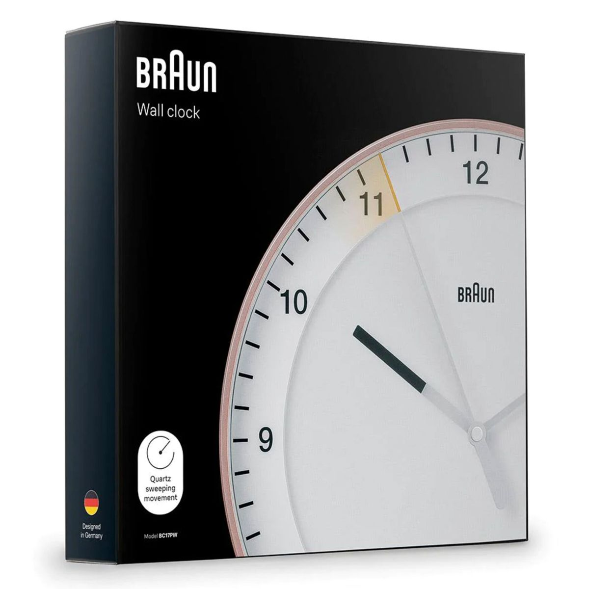 Braun Wanduhr-Verpackung mit Uhranzeige, "Designed in Germany" Aufdruck.