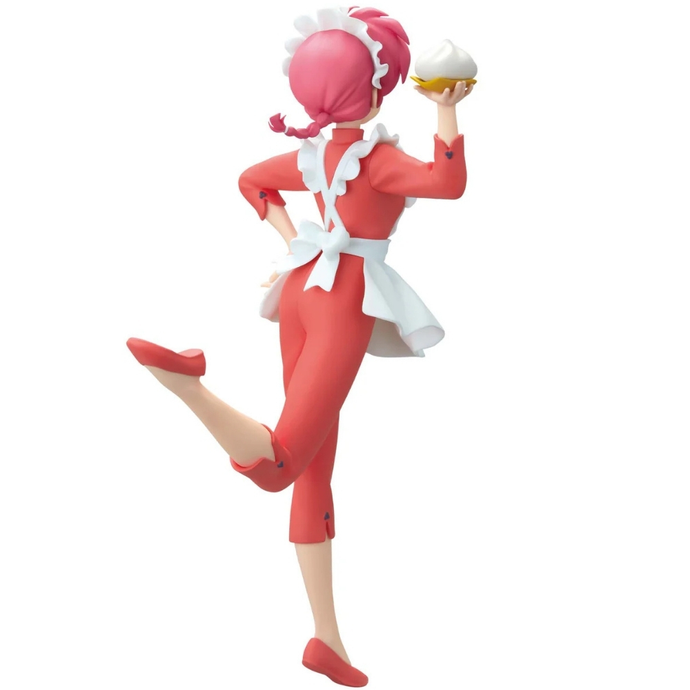 Una figura in rosso con grembiule bianco tiene un dolce. Indossa cappello e scarpe rosse.