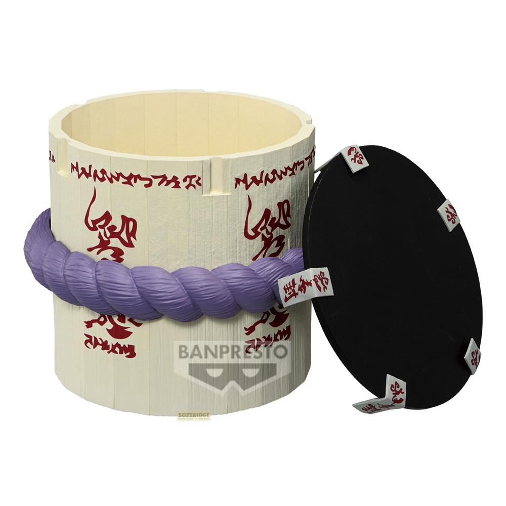 Un contenitore color crema con corda viola e simboli rossi, accanto a un coperchio nero.
