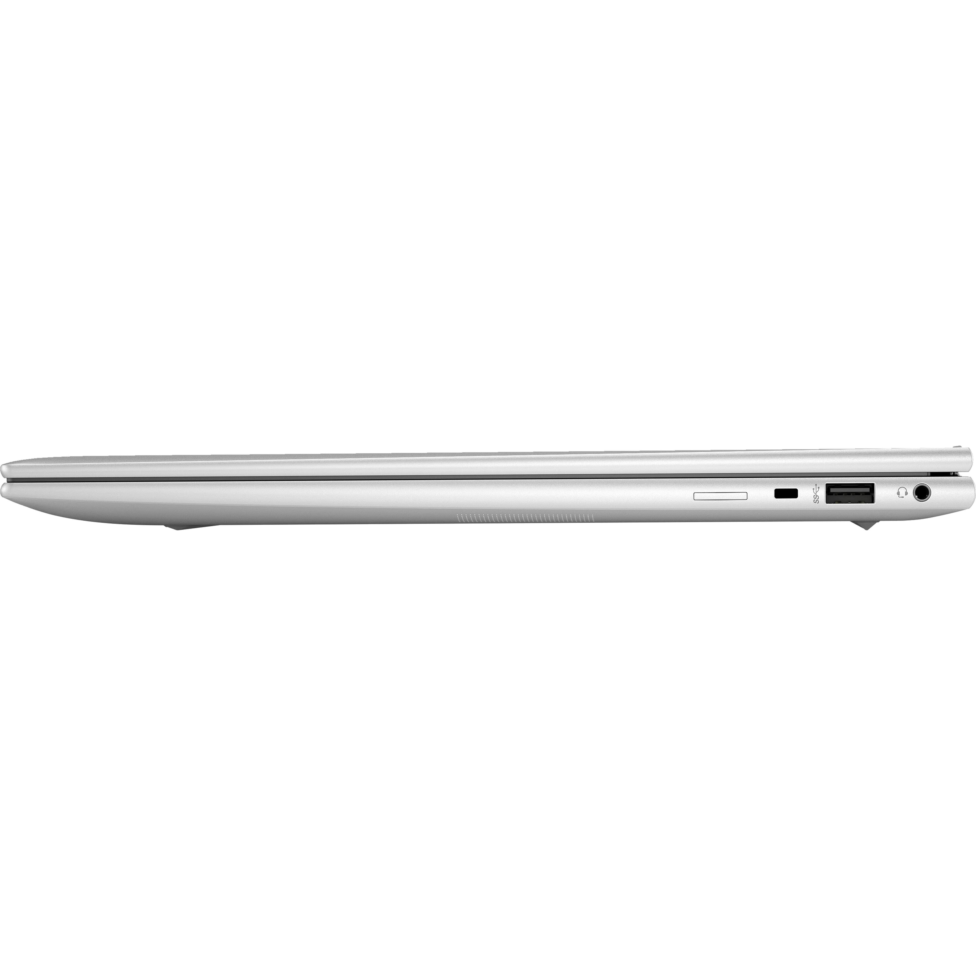 Zilveren laptop van de zijkant, met zichtbare poorten zoals USB en koptelefoon.