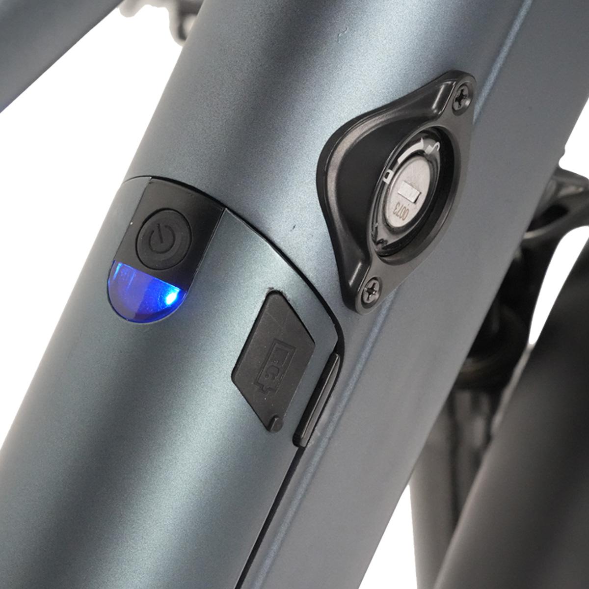 Ein graues Fahrrad mit einem blauen Licht und einem Schlüsselloch.