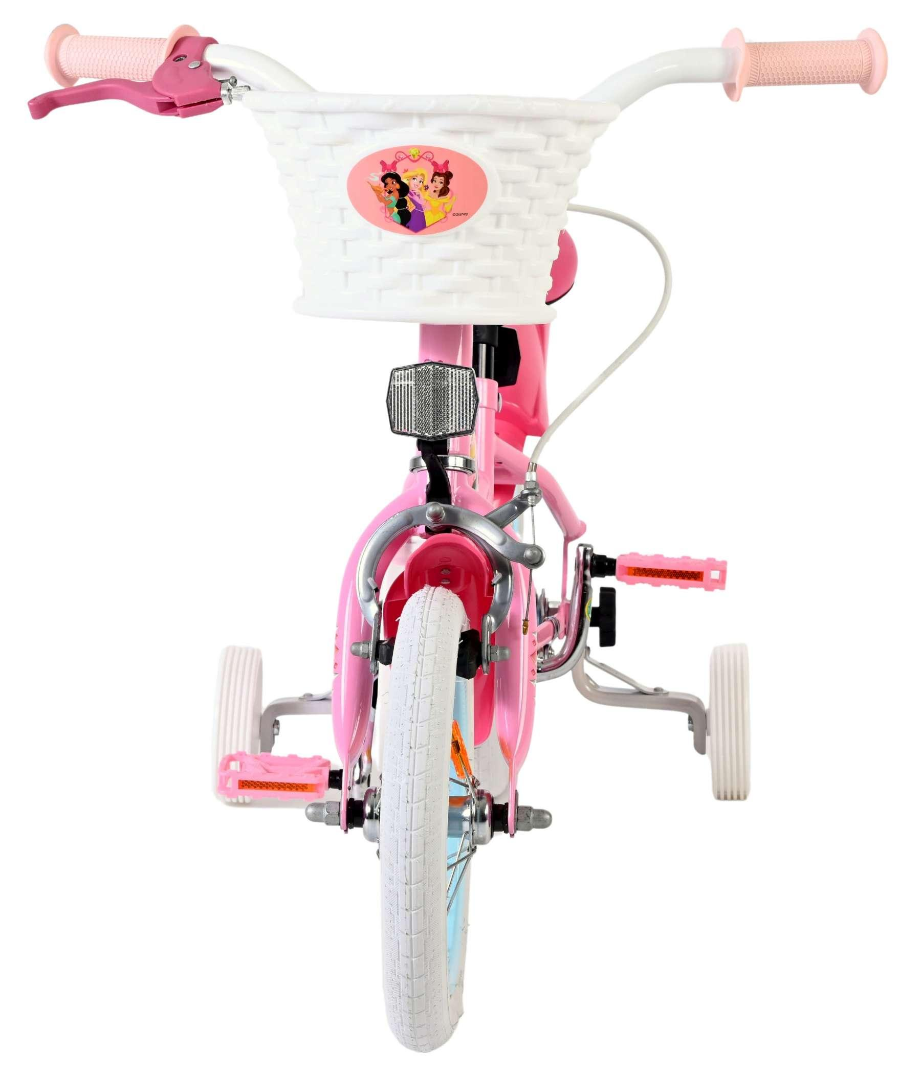 Ein rosafarbenes Kinderfahrrad mit Stützrädern, weißem Korb und Prinzessinnen-Aufkleber.