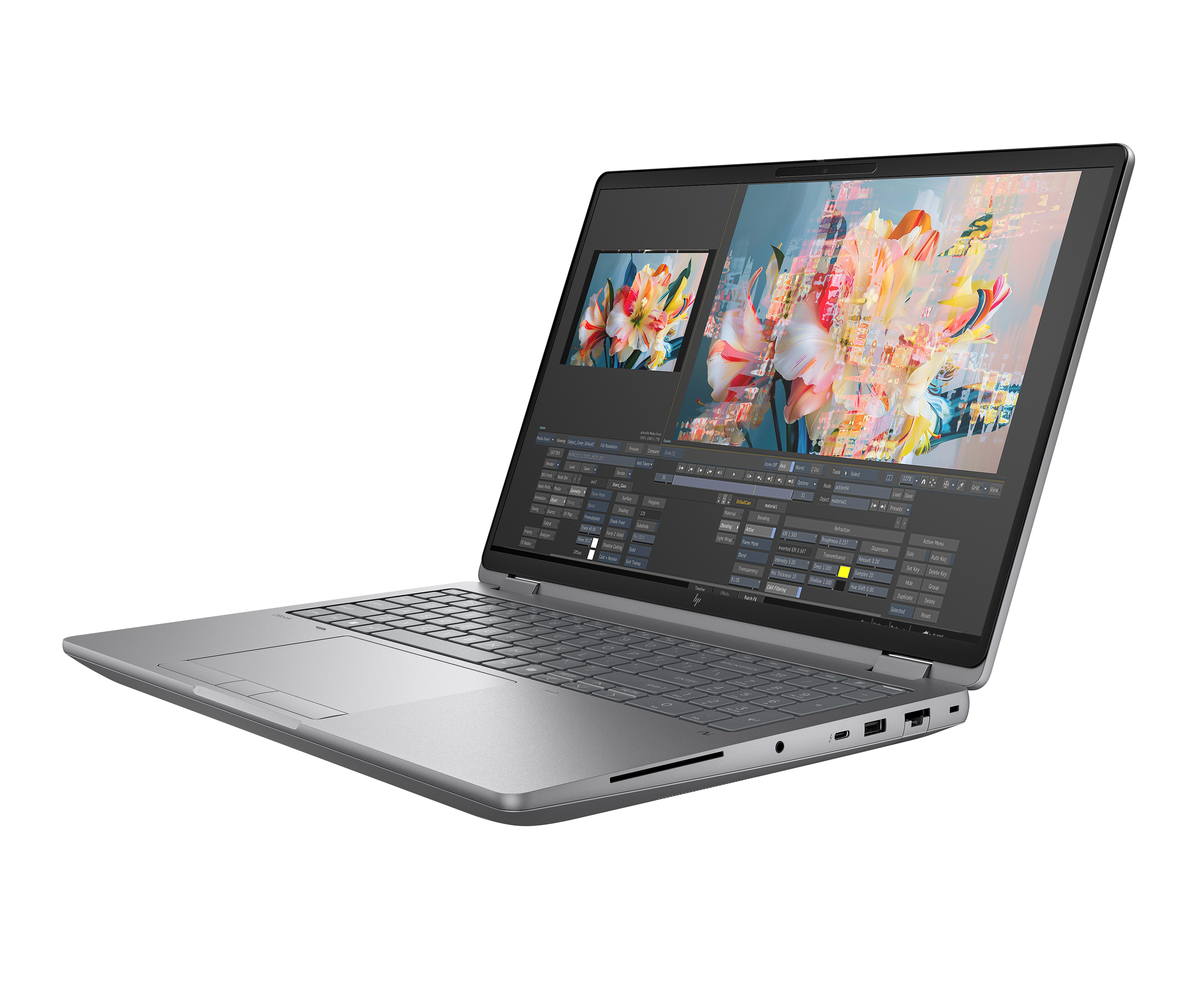 A silver laptop with its screen open, displaying colorful flowers and software interfaces.