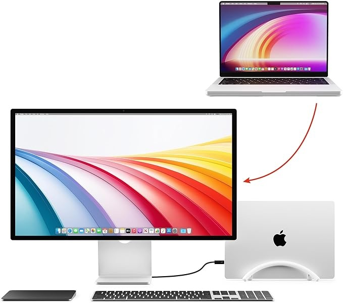 A laptop and a large monitor showing colorful wavy backgrounds.