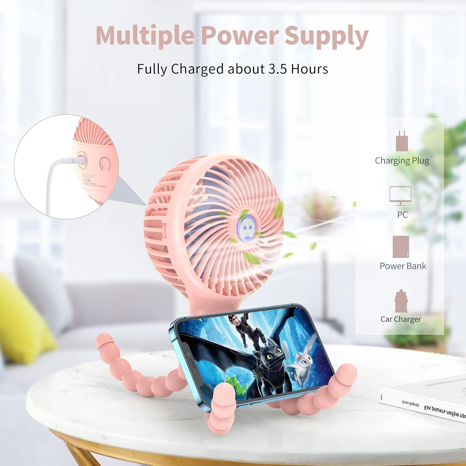 Ein rosafarbener Ventilator mit Schwanenhals hält ein Smartphone, das einen Film zeigt.