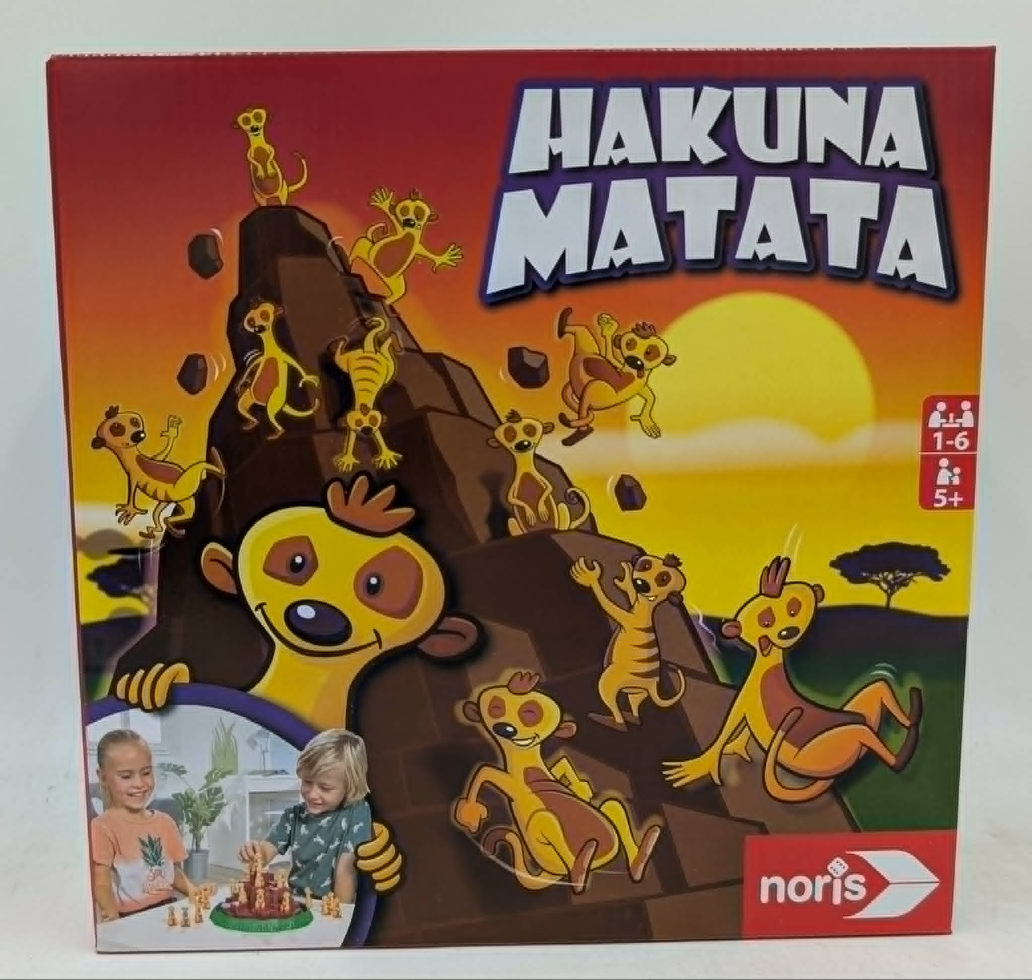 Spielverpackung: Hakuna Matata mit Erdmännchen-Figuren und Kindern im Vordergrund.